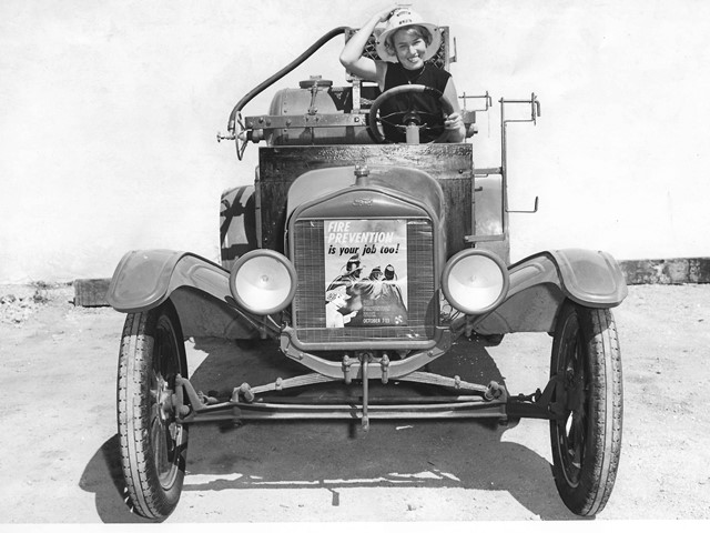 Chemical Engine is on display for Fire Prevention Week. Posing women is unknown. Livermore Fire Department.