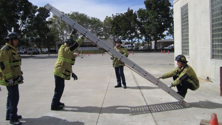 two trainees at each of a ladder during ladder training